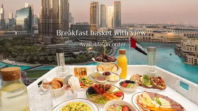 a breakfast buffet with a view of a city at Elite Royal Apartment - Sky Series - Highest Apartment Floor - Full Burj Khalifa & New Fountain View - Eternal in Dubai