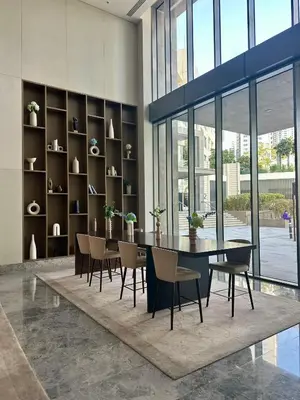 a dining room with a table and chairs at Creek Harbour Home Burj Khalifa Downtown View in Dubai