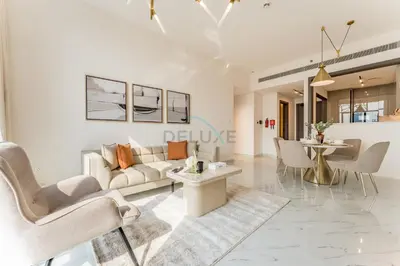 a living room with a couch and chairs and a table at Perfectly Positioned Near Dubai Miracle Garden and Butterfly Garden, Quick Drive to Global Village, Adhara Star, Arjan by Deluxe Holiday Homes in Dubai