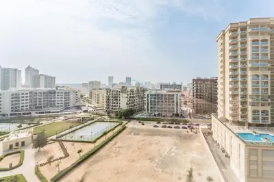 an aerial view of a city with tall buildings at Perfectly Positioned Near Dubai Miracle Garden and Butterfly Garden, Quick Drive to Global Village, Adhara Star, Arjan by Deluxe Holiday Homes in Dubai