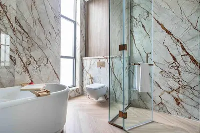 a bathroom with a tub and a glass shower at Frank Porter - Villa La Mer, Jumeirah 1 in Dubai