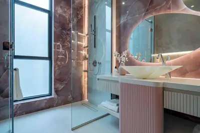 a bathroom with a sink and a glass shower at Frank Porter - Villa La Mer, Jumeirah 1 in Dubai