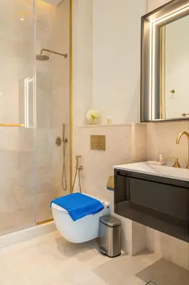 a bathroom with a toilet and a sink and a shower at New Arabian Palm Hills 6BR & Maid & Private Pool in Dubai
