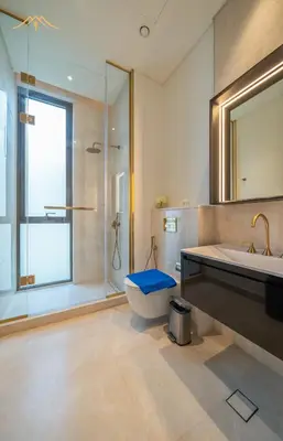 a bathroom with a tub and a toilet and a sink at New Arabian Palm Hills 6BR & Maid & Private Pool in Dubai