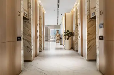a hallway in a building with wooden walls at Stylish Missoni Studio With Direct Pool Access in Dubai