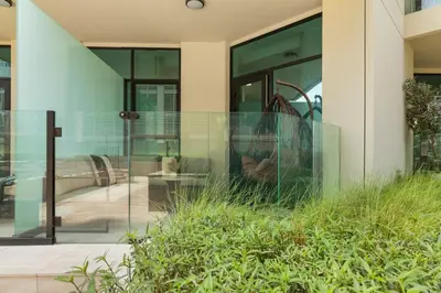 a glass facade of a building with a cat in the window at Stylish Missoni Studio With Direct Pool Access in Dubai