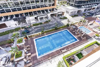 an overhead view of a swimming pool in a city at Bright & Stylish Home in the Heart of Meydan in Dubai