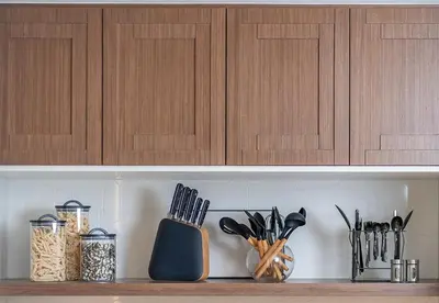 a shelf with knives and utensils on it at 1 Bed in Palace Beach Residence with sea view in Dubai