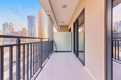 a balcony with a view of the city at Compact 1 BHK Apartment in Dubai