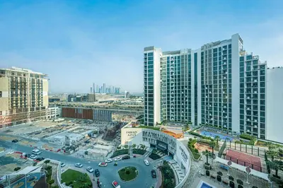 an aerial view of a city with tall buildings at Livin' Holidays -Studio - Azizi Magnificent Studio in Dubai