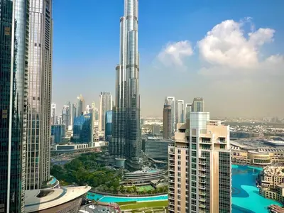 a view of a large city with tall buildings at SKYLiNE - 4 BR - BURJ KHALiFA & FOUNTAiN ViEW in Dubai