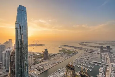 a view of the city of dubai at sunset at Central Spacious Marina Home on the 64th Floor in Dubai