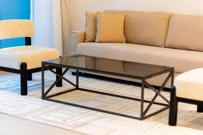 a living room with a couch and a coffee table at 1BR Lake & Harbour View Dubai Creek Harbour in Dubai