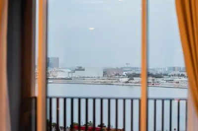 a view of a body of water from a window at 1BR Lake & Harbour View Dubai Creek Harbour in Dubai