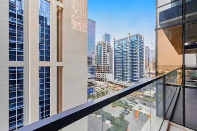 a view of a city from the balcony of a building at Bright 2 BHK in Prime Location in Dubai