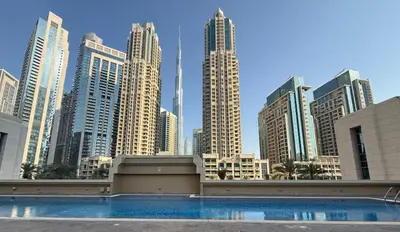 a view of a city skyline with a swimming pool at Elite Downtown 1BR Stylish 1BR in Dubai