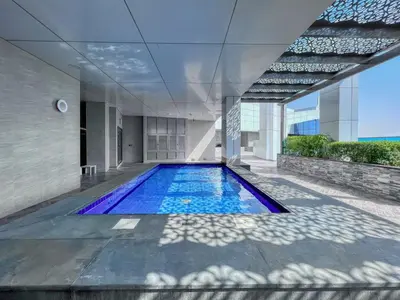 a swimming pool in the middle of a building at GuestReady – Business Bay Bliss | Near Dubai Mall in Dubai