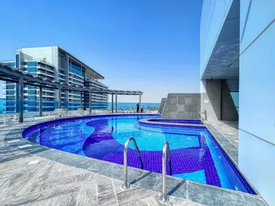 a swimming pool on the roof of a building at GuestReady – Business Bay Bliss | Near Dubai Mall in Dubai