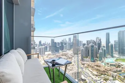 a room with a view of a city at Elite Burj Khalifa Fountain 4 BR Flat in Dubai