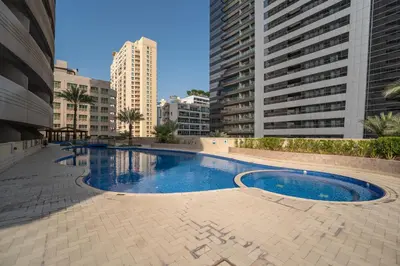 a swimming pool in a city with tall buildings at Marcopolo - Relaxing 1BR in Dubai Marina with Huge Balcony in Dubai