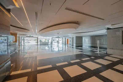 a large lobby with a tile floor in a building at Marcopolo - Relaxing 1BR in Dubai Marina with Huge Balcony in Dubai