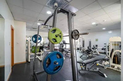 a gym with several tread machines in a room at Marcopolo - Relaxing 1BR in Dubai Marina with Huge Balcony in Dubai