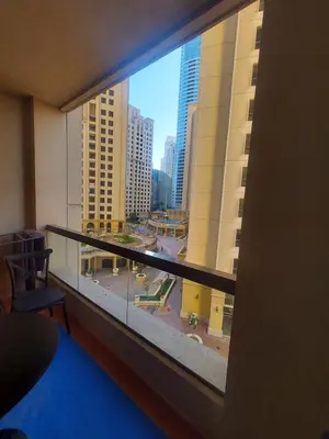 a view of a city from a window in a building at Dubai Short Stay Vacation Homes Rental Room in Dubai