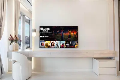 a living room with a tv on a wall at Serene Waterfront Gem UPSCALE in Dubai