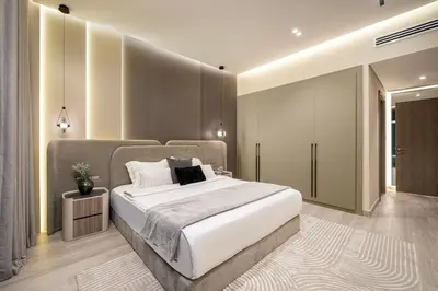 a bedroom with a large white bed in it at Paradise Retreats 3BR Burj Khalifa & Fountain view in Dubai