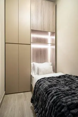 a bedroom with a large bed and a closet at Paradise Retreats 3BR Burj Khalifa & Fountain view in Dubai