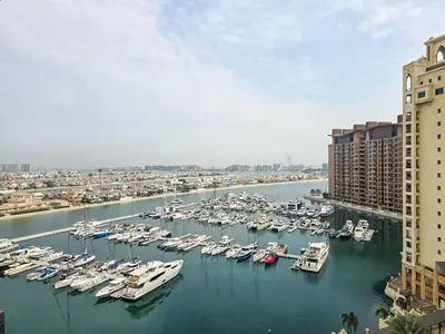 a bunch of boats are docked in a harbor at Marina Residence 5, Palm Jumeirah - Mint Stay in Dubai