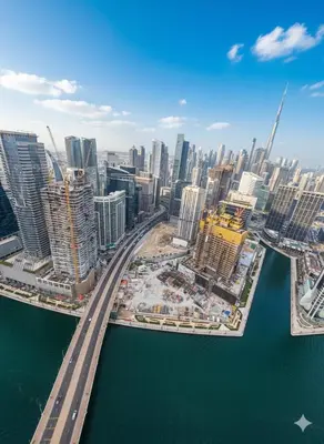 an aerial view of a city with a bridge over the water at Luxury 2BR with Maid Burj Khalifa and Canal View in Dubai