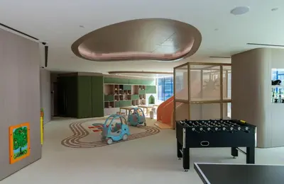 a childrens room with a room with a play implement at Binghatti Royale Luxe 1BR Serenity with Private Pool! in Dubai