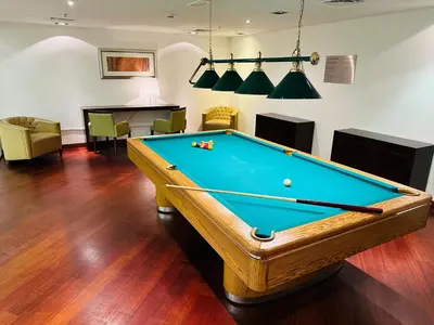 a billiard room with a pool table in it at Dubai Marina Penthouse Suite - Prime Location in Dubai