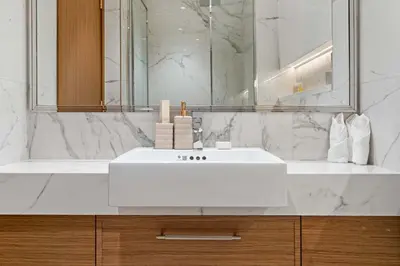 a bathroom with a white sink and a mirror at Modern 1BR Apartment w Balcony in Meydan in Dubai