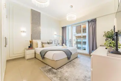 a bedroom with a bed and a large window at Minutes from Marina Promenade, Surrounded by Shops, and a Short Drive to Ain Dubai, Opal Tower, Dubai Marina by Deluxe Holiday Homes in Dubai