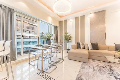 a living room with a couch and a table at Minutes from Marina Promenade, Surrounded by Shops, and a Short Drive to Ain Dubai, Opal Tower, Dubai Marina by Deluxe Holiday Homes in Dubai
