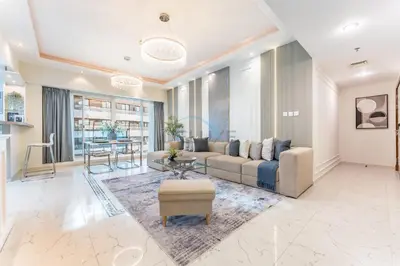 a living room with a couch and a table at Minutes from Marina Promenade, Surrounded by Shops, and a Short Drive to Ain Dubai, Opal Tower, Dubai Marina by Deluxe Holiday Homes in Dubai