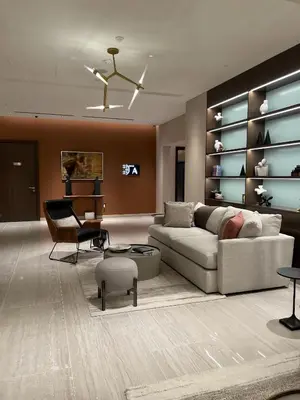 a living room with a couch and a piano at Sohba Creek Vistas Luxury 2 Bedroom with Free Parking in Downtown Dubai Near Burj Khalifa in Dubai