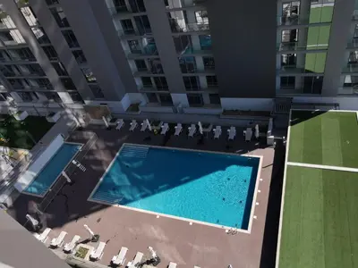 an overhead view of two swimming pools in a building at Sohba Creek Vistas Luxury 2 Bedroom with Free Parking in Downtown Dubai Near Burj Khalifa in Dubai