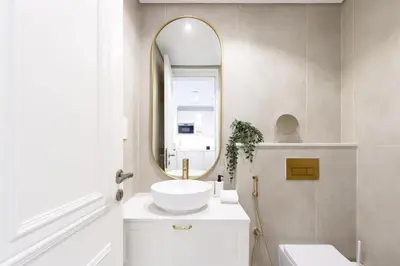 a bathroom with a sink and a mirror at Relaxing 1BR Peaceful Family Living in JVC in Dubai