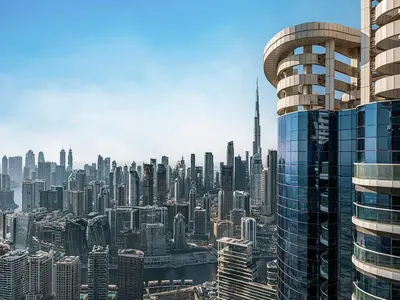 a view of a large city with tall buildings at Spacious 3BR in Paramount Tower Luxury Living in Dubai