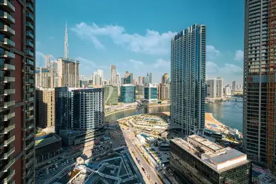 a view of a city with buildings and traffic at Brand New Exclusive 2BR, Burj and Canal View in Dubai