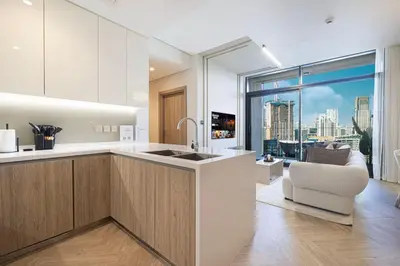 a kitchen with a view of a city at Brand New Exclusive 2BR, Burj and Canal View in Dubai