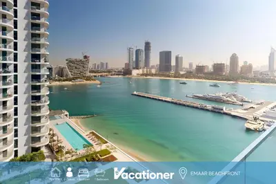 a view of a river in a city with buildings at Vacationer l Classy 1 Bedroom l Yacht Views l Private Beach in Dubai