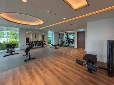 a gym with treadmills and cardio equipment in a building at Vacationer l Classy 1 Bedroom l Yacht Views l Private Beach in Dubai