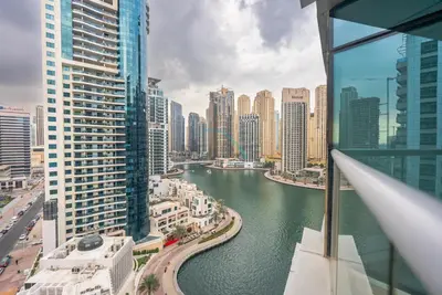 a view of a river in a city with tall buildings at Marina Canal View Apartment, Walking Distance to The Metro and Tram, Near The Beach and Top Dining - Bayside Residence, Dubai Marina by Deluxe Holiday Homes in Dubai