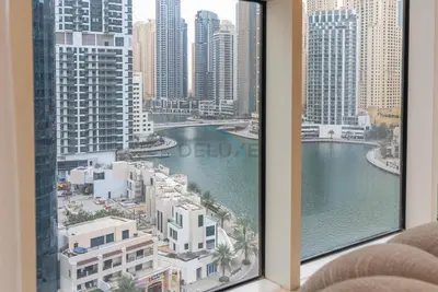 a view of a city from a hotel window at Marina Canal View Apartment, Walking Distance to The Metro and Tram, Near The Beach and Top Dining - Bayside Residence, Dubai Marina by Deluxe Holiday Homes in Dubai