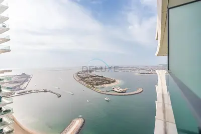 a view of the water from a building at Prime Waterfront Location with Stunning Palm Jumeirah Views, Close to Dubai Top Attractions - Beach Vista Tower 2, Emaar Beachfront by Deluxe Holiday Homes in Dubai