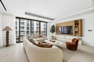 a living room with a couch and a tv at Upscale City Walk 3BR plus Maid Near Dubai Mall in Dubai